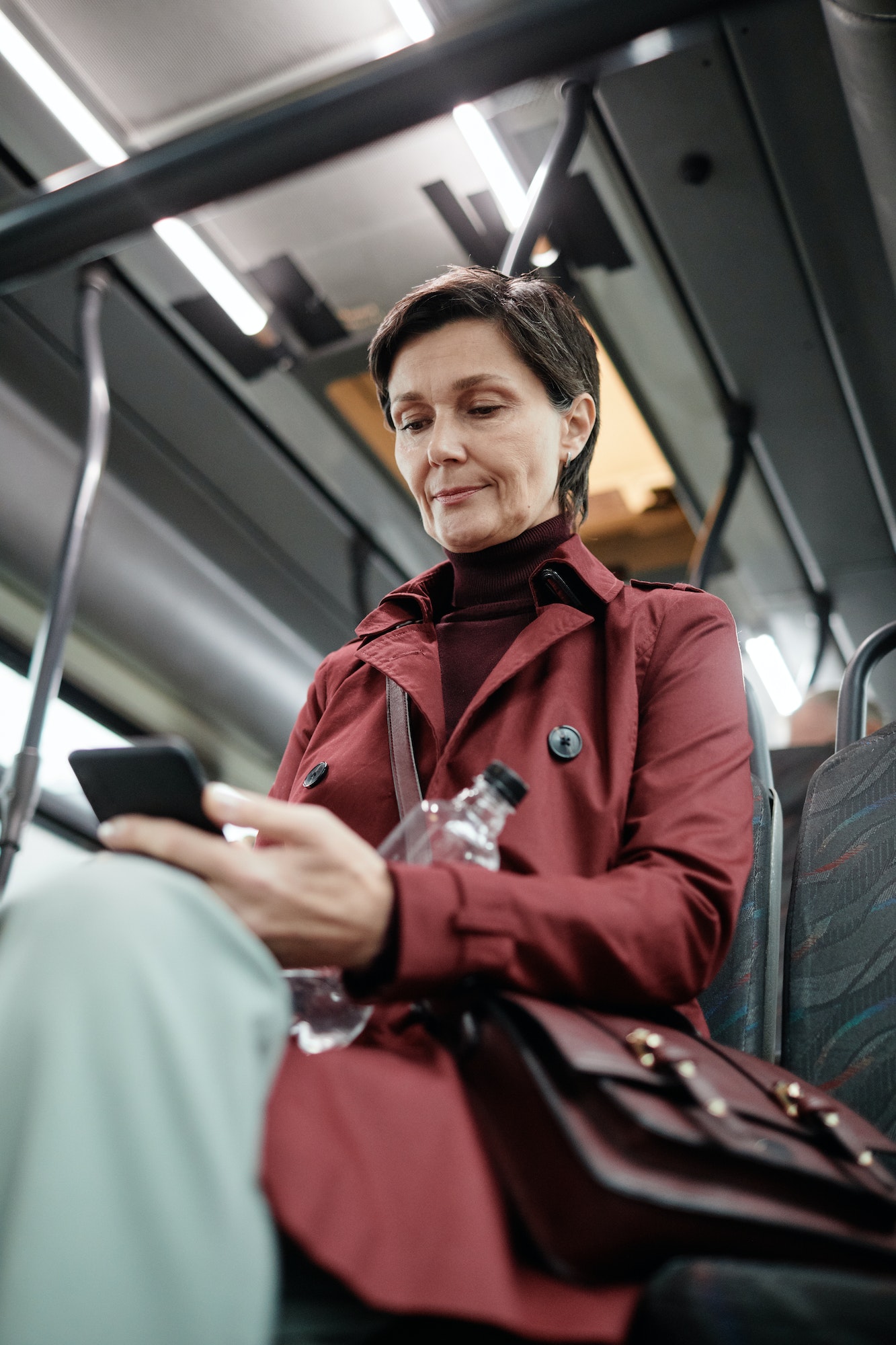 Adult Woman Traveling by Bus in City