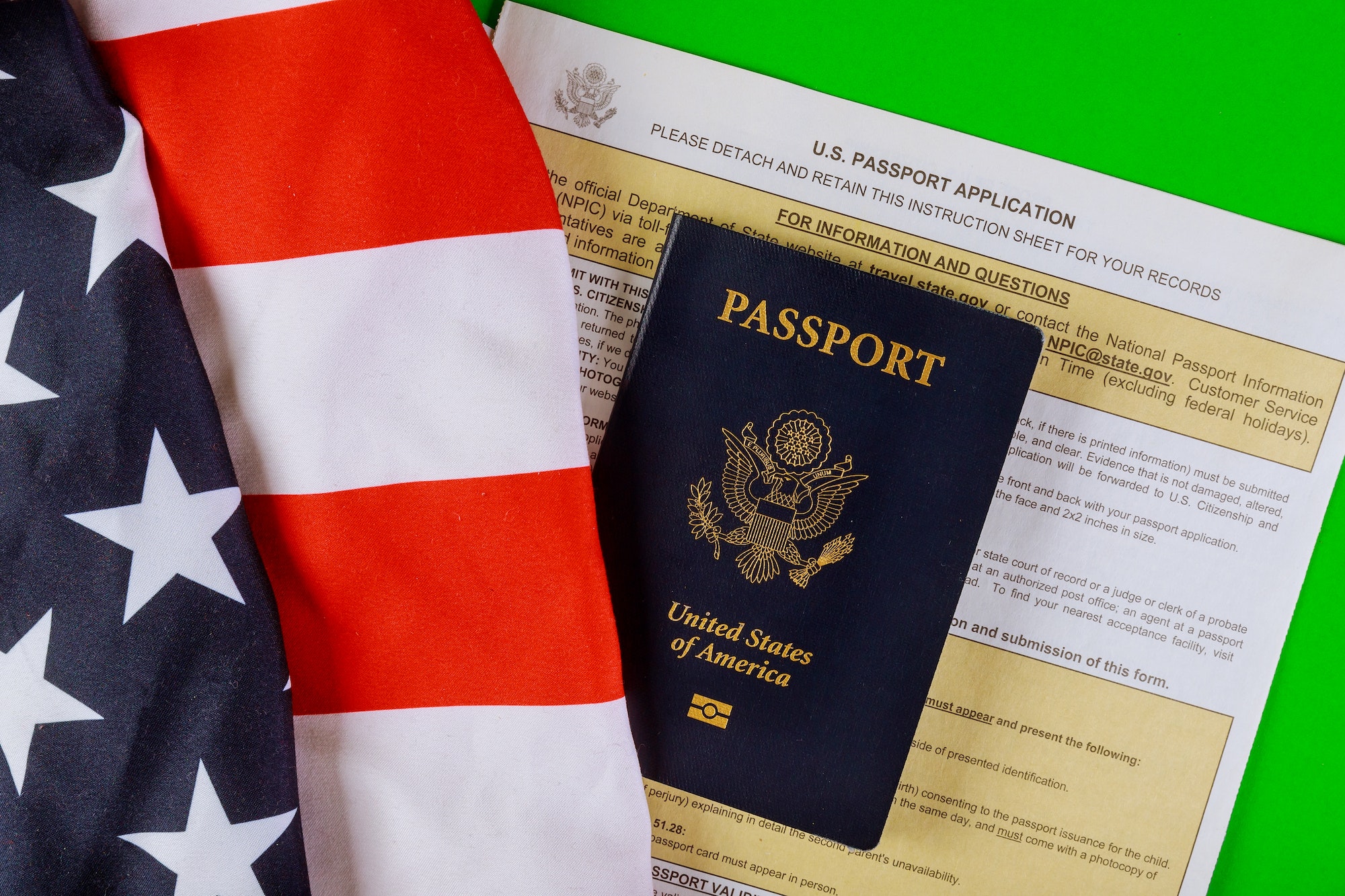 Applying form New Passport for U.S. passport application, flags of USA lying at passport