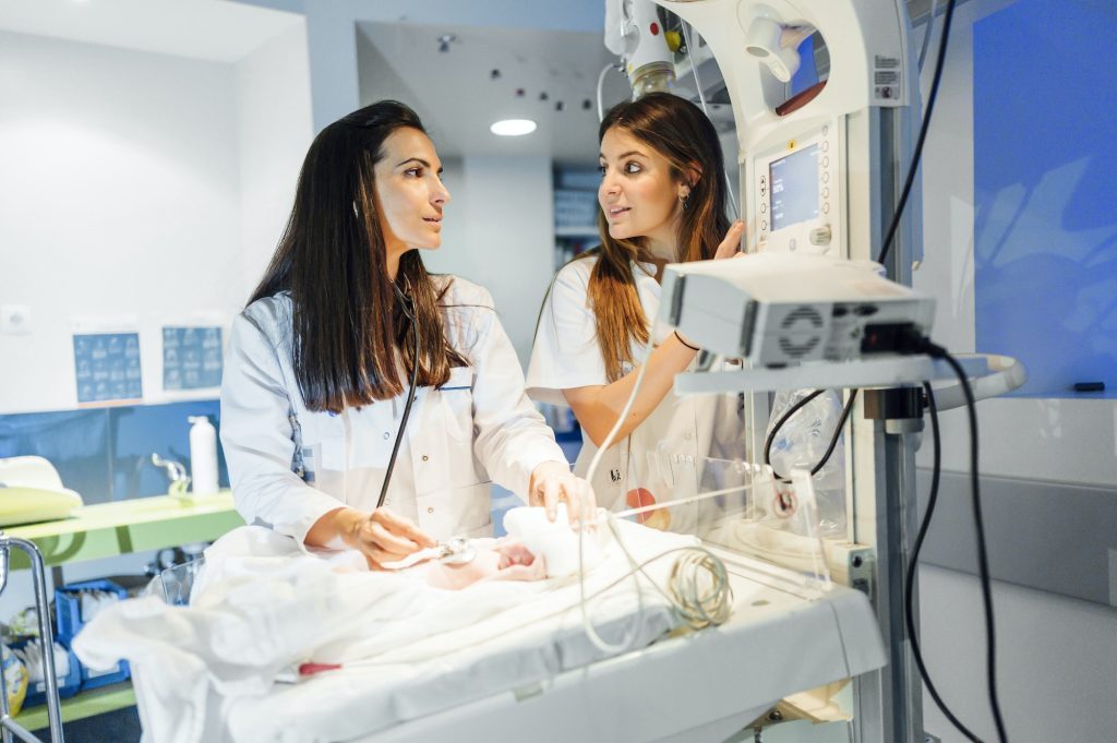 Crop doctor listening heart of baby