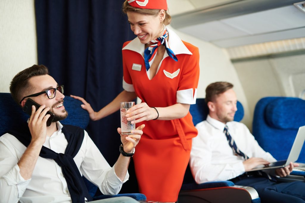 Flight Attendant Serving Drinks
