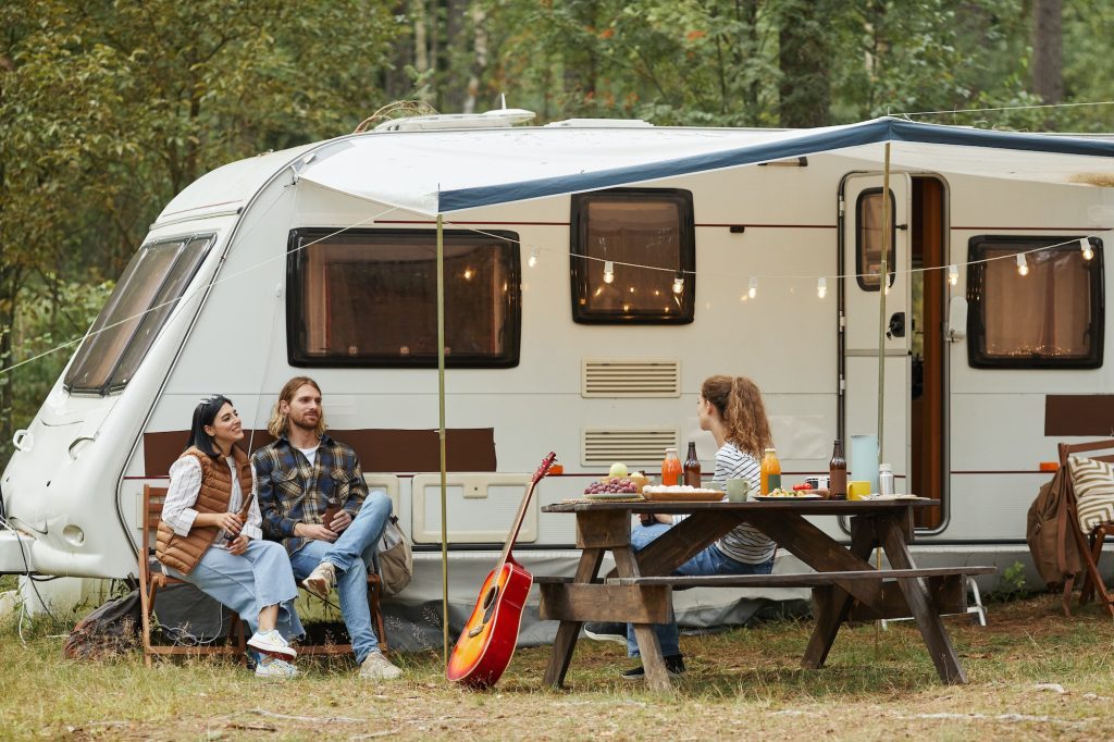 Friends Relaxing by RV Van