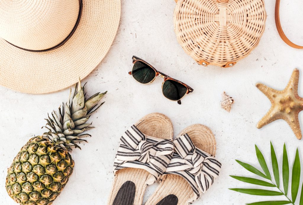 Overhead image of beach accessories. Summer flat lay with travel essentials.