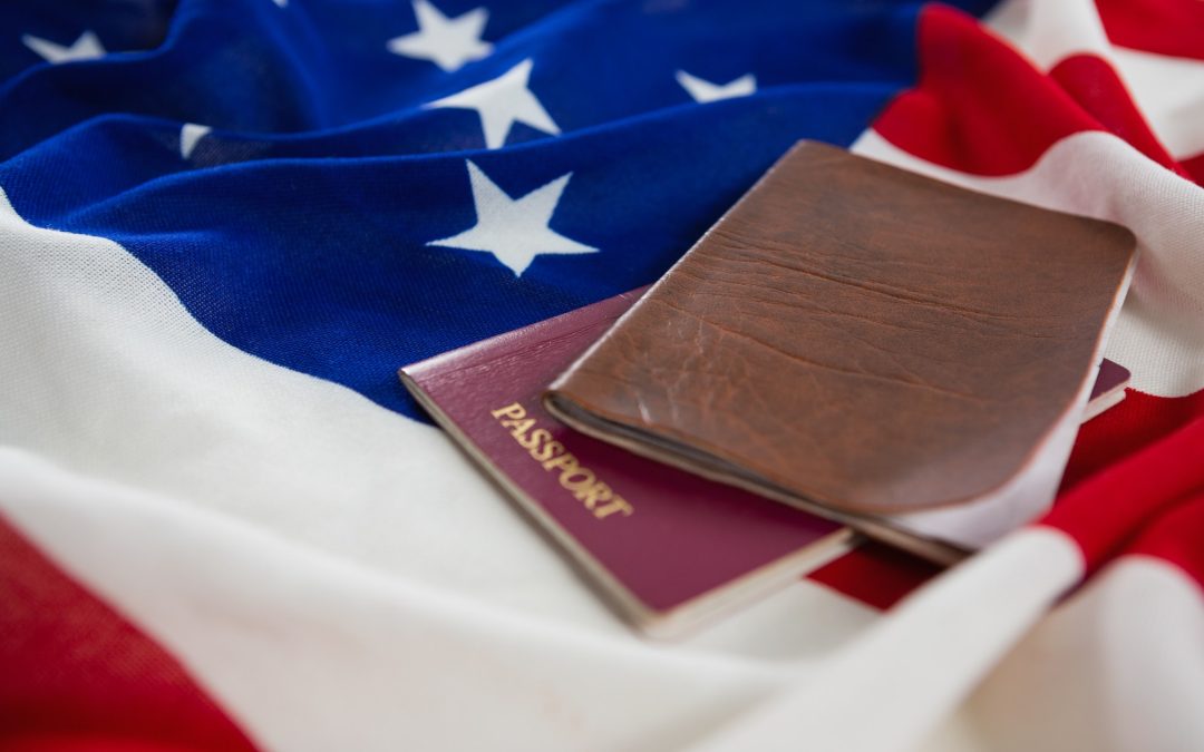 Passport and visa on an American flag