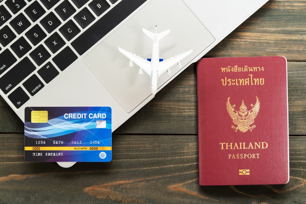 Passport with credit card on laptop-2