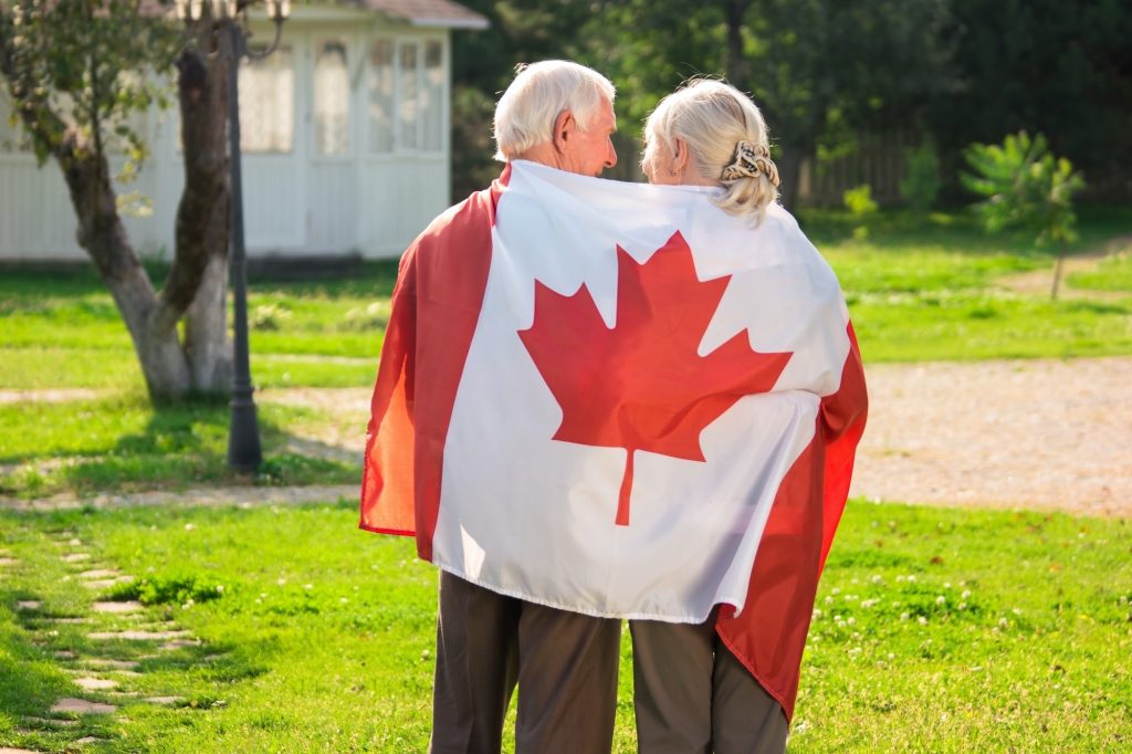 Senior couple and Canadian flag