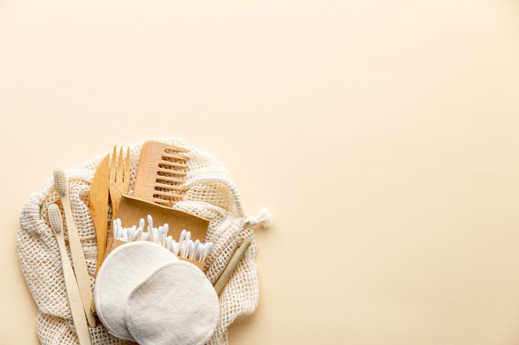 Set of eco friendly toiletries and bathroom products on color background, flat lay