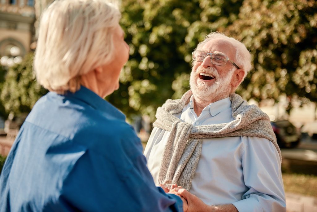 so-funny-happy-and-beautiful-elderly-couple-holding-hands-and-laughing-while-standing-outdoors-1024x684-7404672