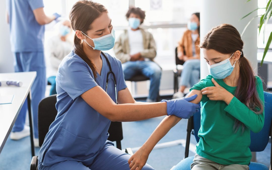 Teen Getting Vaccinated Against Covid, Nurse Applying Adhesive Bandage