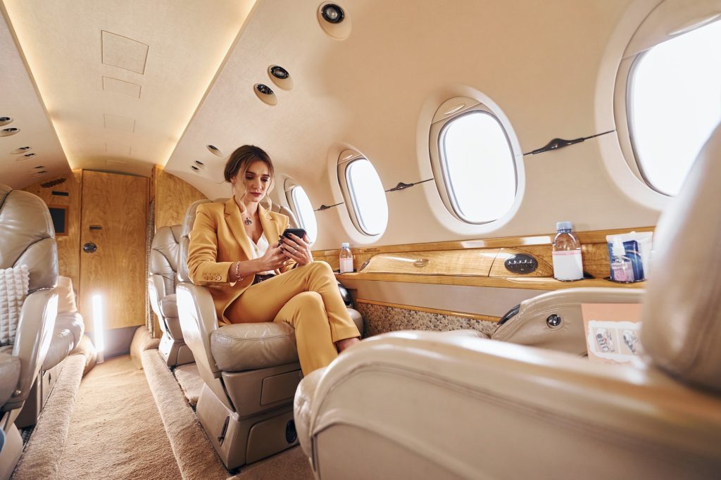 woman-in-yellow-clothes-sits-inside-of-private-airplane-1024x682-3569209